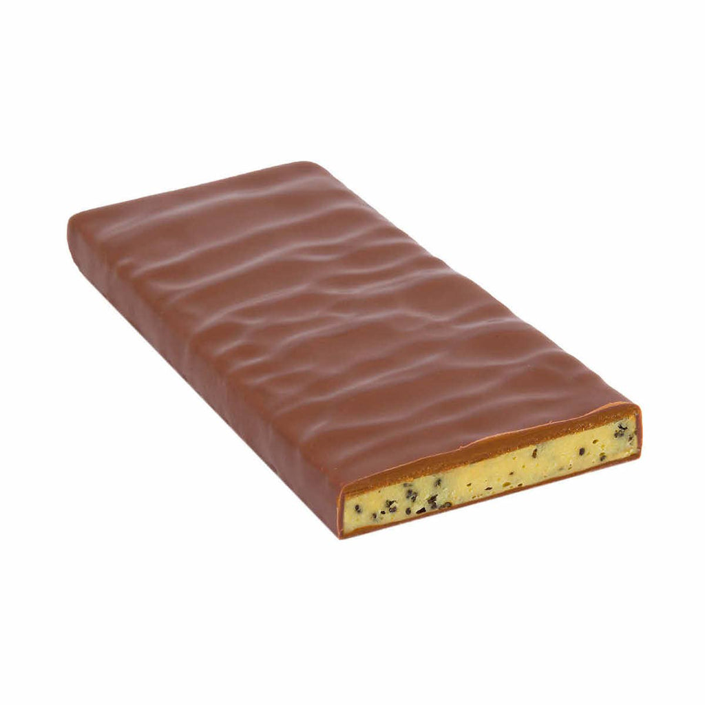 Unwrapped Stress Stopper White Chocolate Ganache with Caramelized Blue Poppyseed bar against a white background