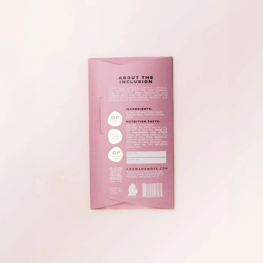 Back of Passion Fruit Sesame Dark Chocolate Bar 68% packaging with nutrition information and ingredients against a light background
