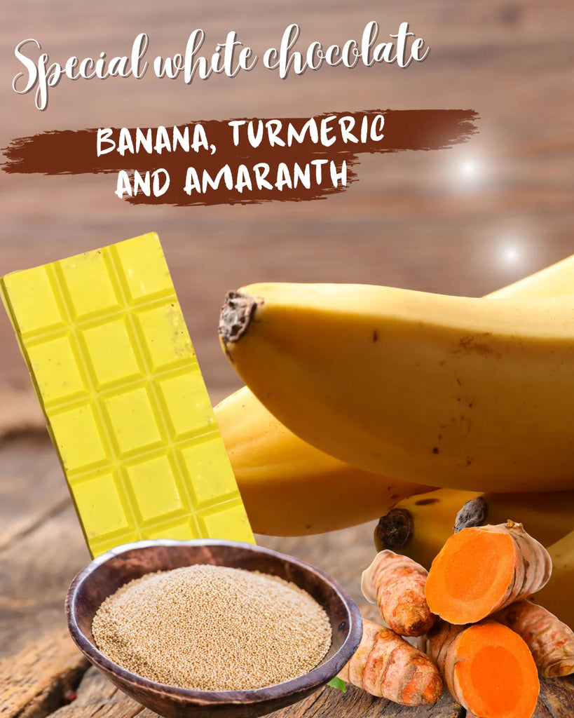Unwrapped White Chocolate with Banana, Turmeric & Amaranth bar on a wooden table with various ingredients
