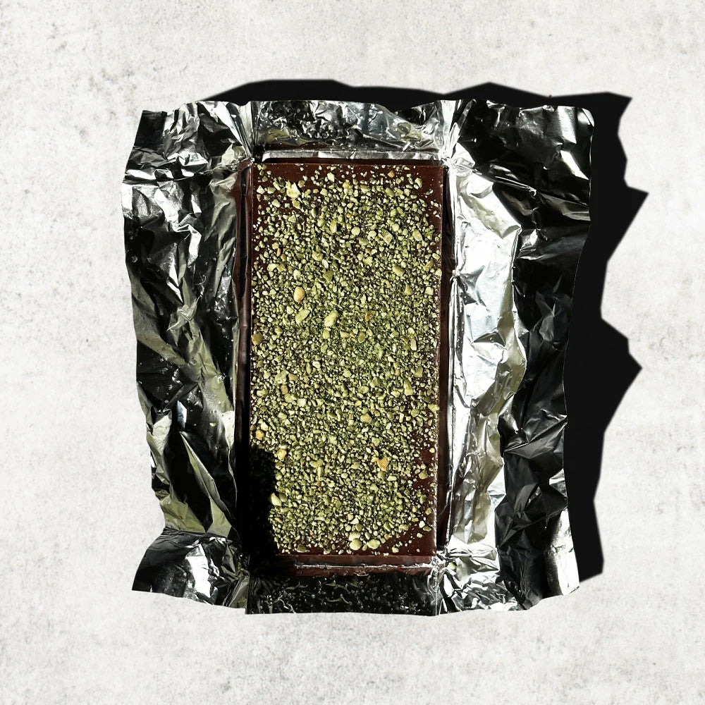 Unwrapped Mayan Pepita 63% bar on a white table