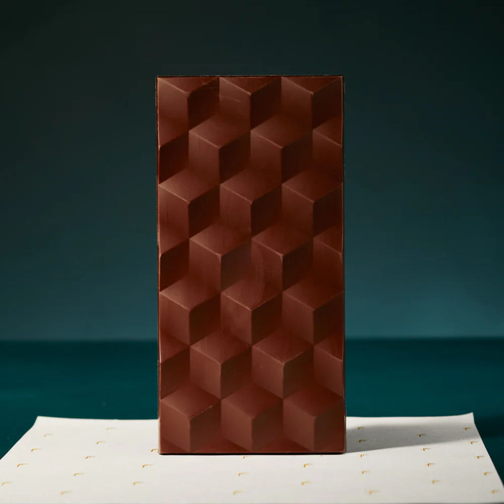 Rectangular chocolate bar with geometric pattern on a dark background