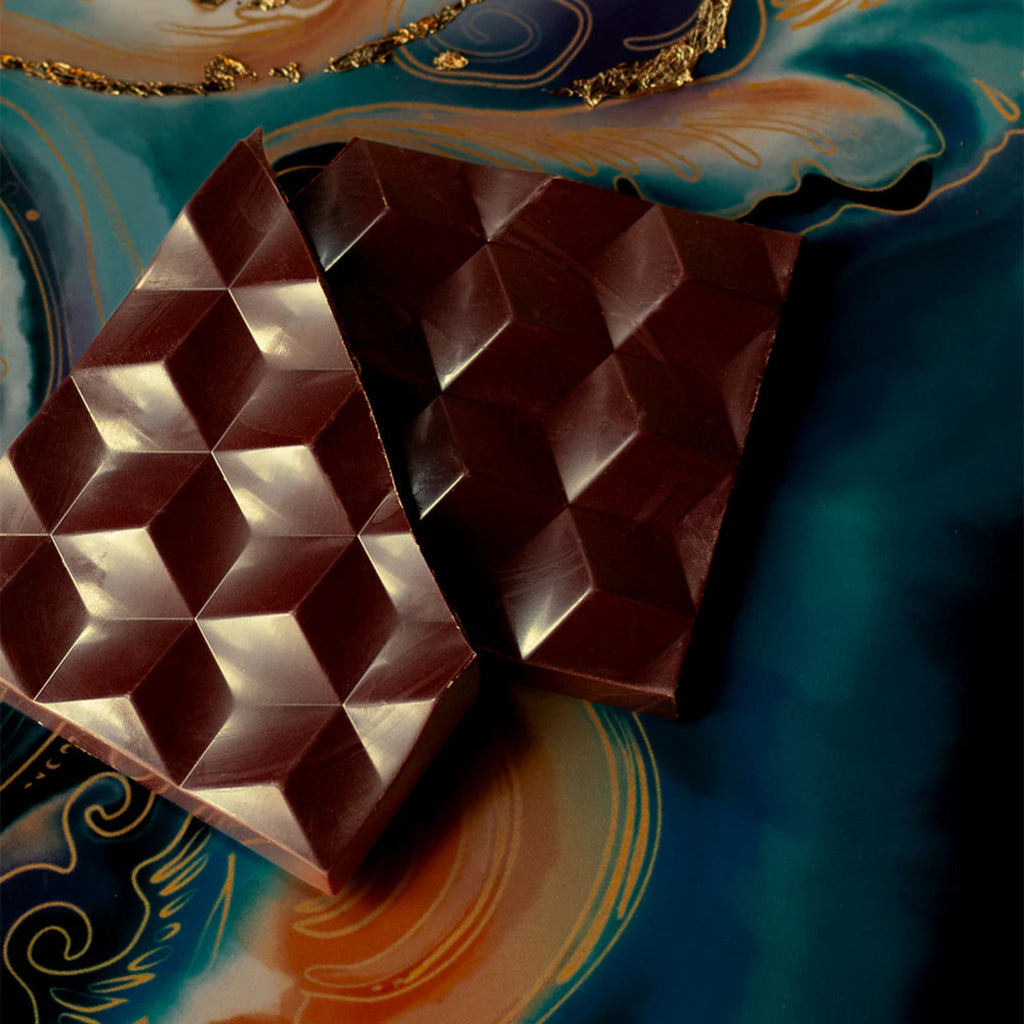 Foundry Limited Edition Whiskey chocolate bar against a geometric pattern on a decorative plate