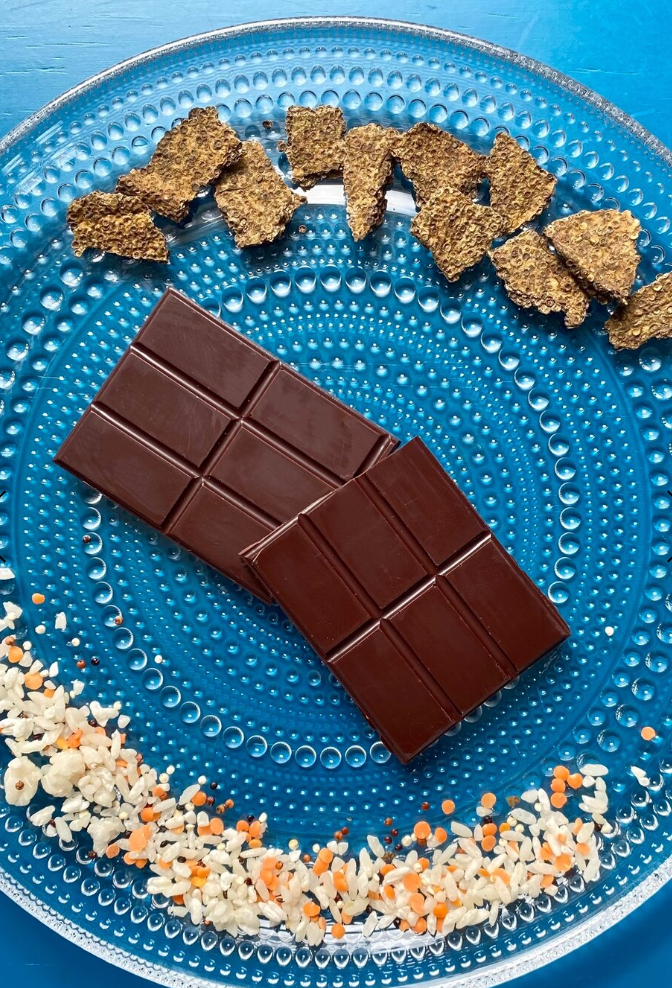 Two unwrapped pieces of 72% Shoyu baron a blue plate with shoyu