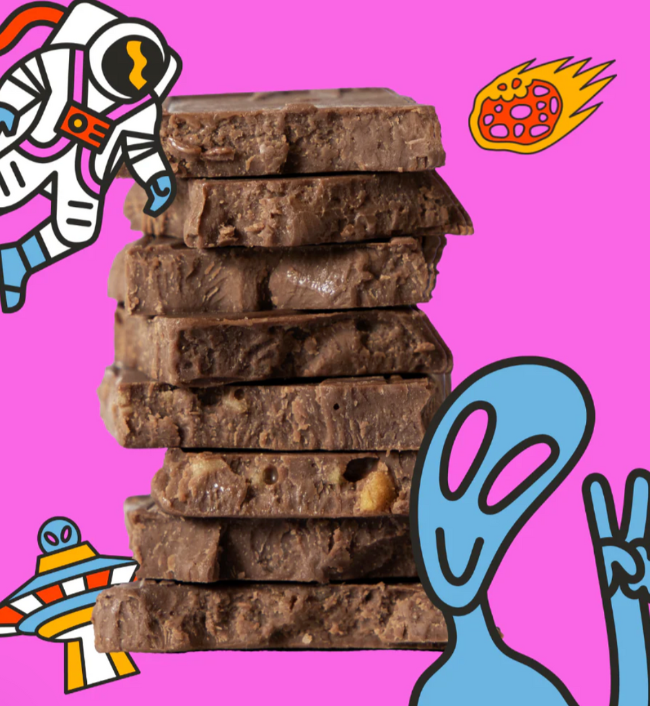 A stack of unwrapped Moon Rocks Truffle Bars from Maeve Chocolate against a pink outline with space graphics