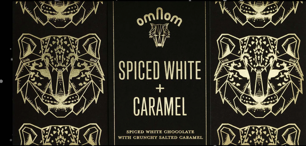 Chocolate packaging with geometric tiger design and 'omnom' branding on a white background.