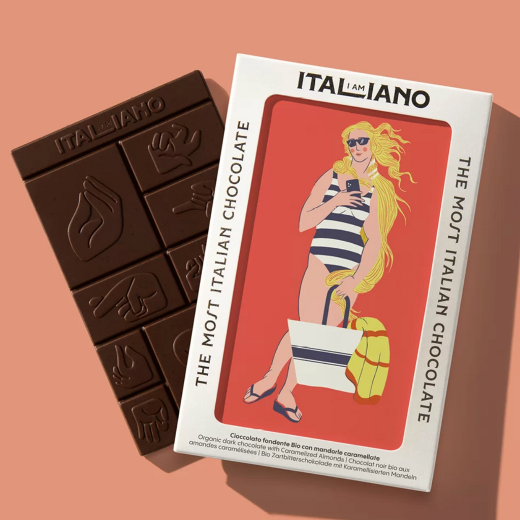 I am Italiano Organic Dark Chocolate with Caramelized Almonds (Pandoro) packaging and unwrapped bar against a salmon background