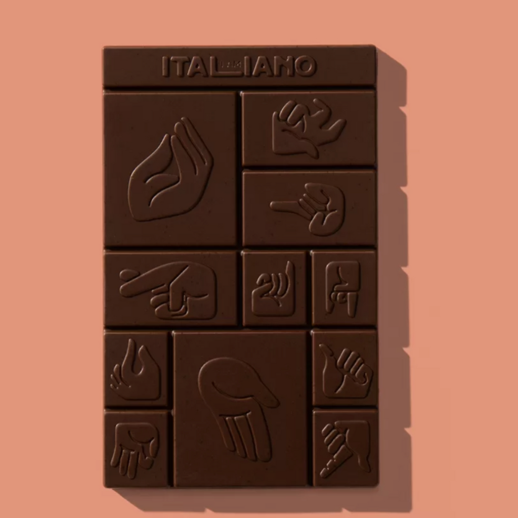 I am Italiano Organic Dark Chocolate with Caramelized Almonds (Pandoro) unwrapped against a salmon background