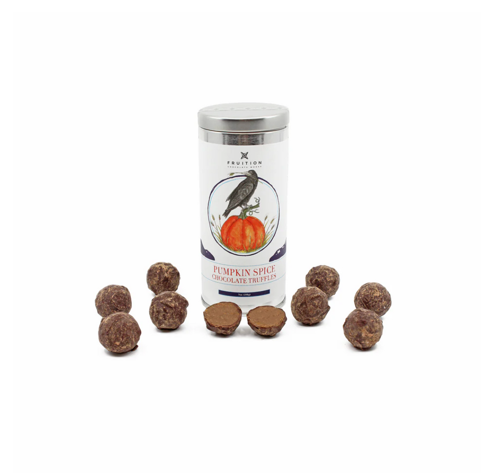 Fruition pumpkin spice chocolate truffles with truffles around on a white background