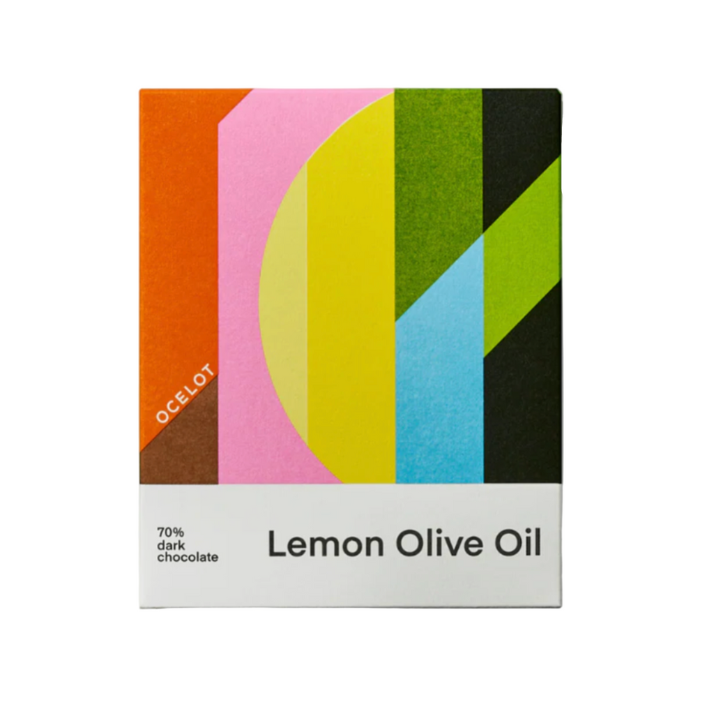 Colorful packaging of Ocelot Lemon Olive Oil dark chocolate bar with geometric design on a white background