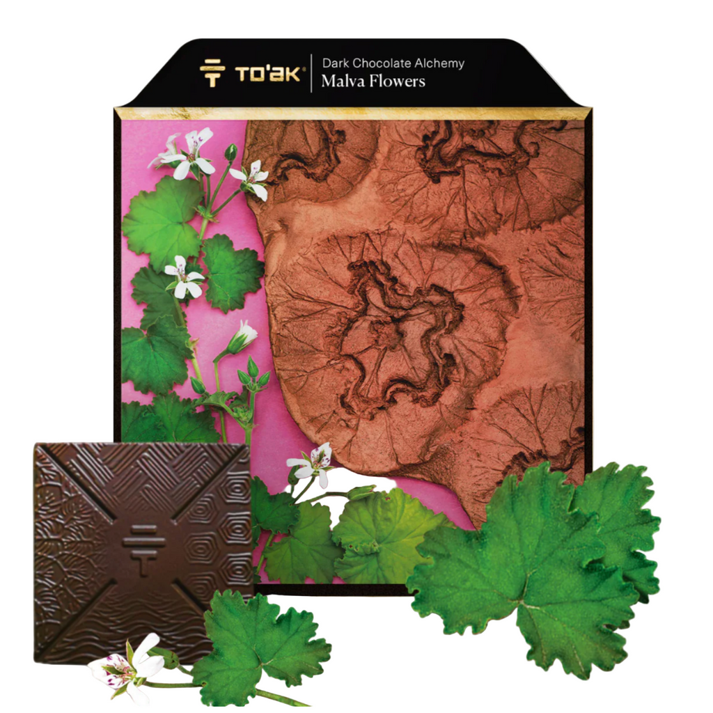 To'ak malva flowers dark chocolate bar with decorative packaging featuring leaves and flowers, branded 'To'ak'.