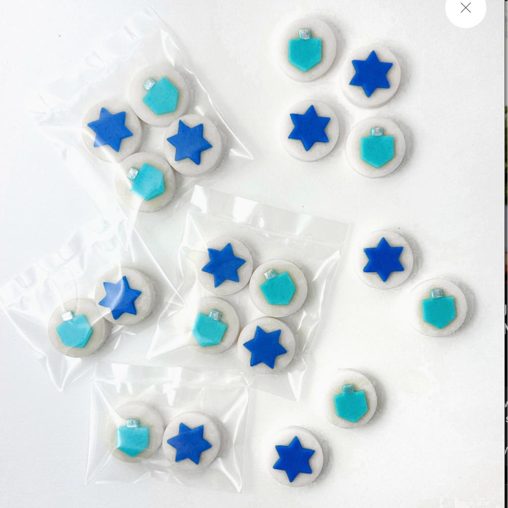 Hanukkah Dreidel & Star Candy Bite Quartets packaging on a light background