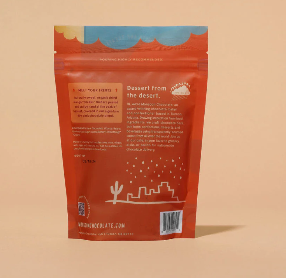 Nutrition facts of Mango Covered in Dark Chocolate from Monsoon Chocolate against an orange background