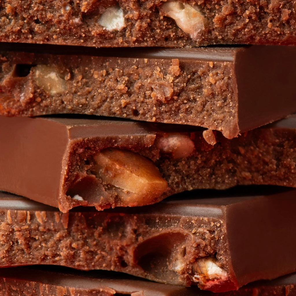 Unwrapped stack of Brown Butter Cardamom + Pecan Mini bars