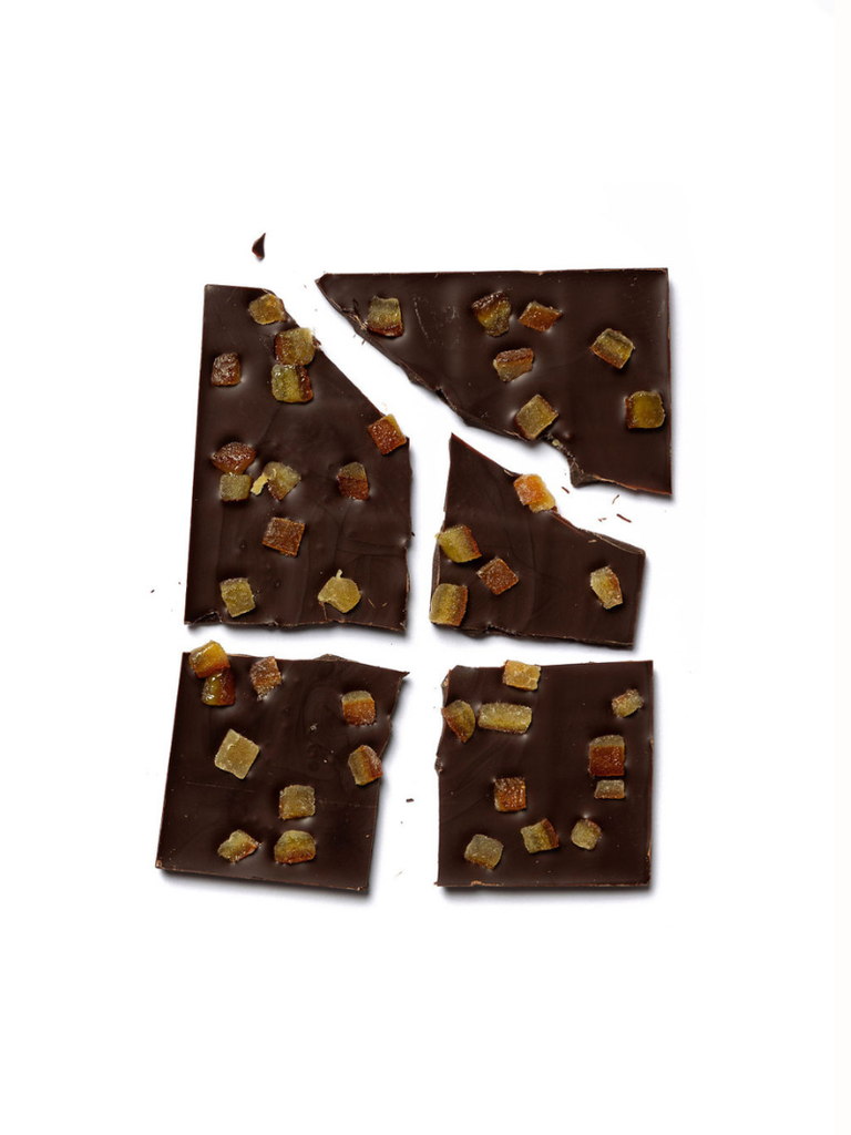 Broken Orange Dark Chocolate 70% pieces against a white background