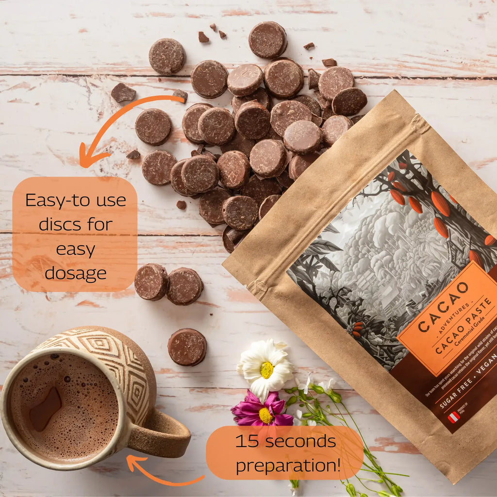 An opened bag of the High-Amazon Basin Ceremonial Grade Cacao spilling out onto a wooden table, next to a beverage and flowers