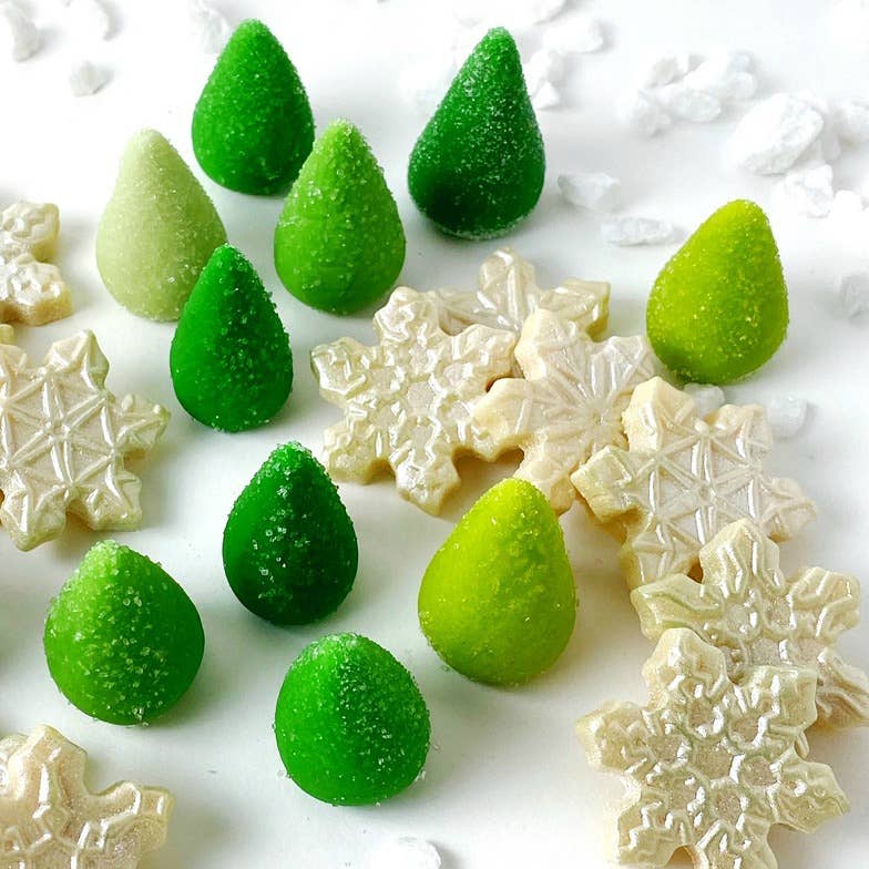 Christmas Trees Candy on a white table with Christmas cookies