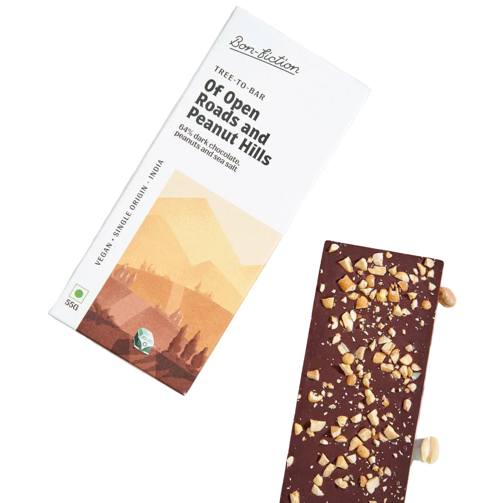 "Of Open Roads and Peanut Hills" - 64% Peanut Dark Chocolate bar with peanut pieces and packaging on a white surface