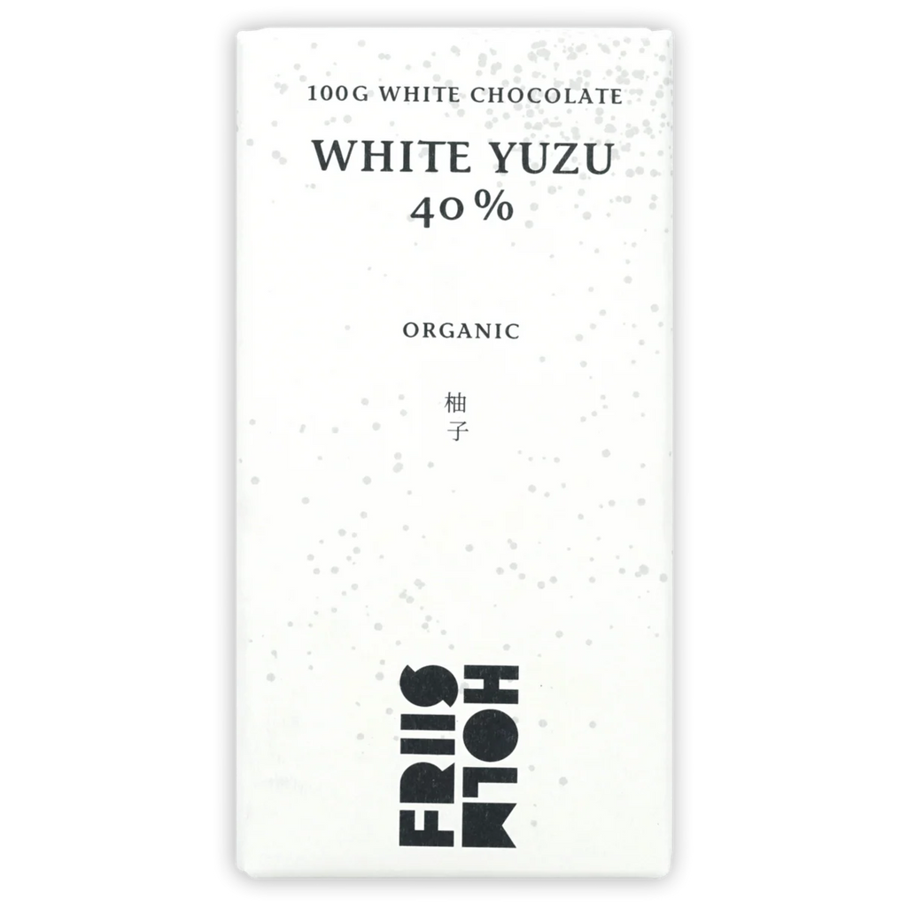 The front of a wrapped White Chocolate w/ Yuzu 40% bar from Friis Holm