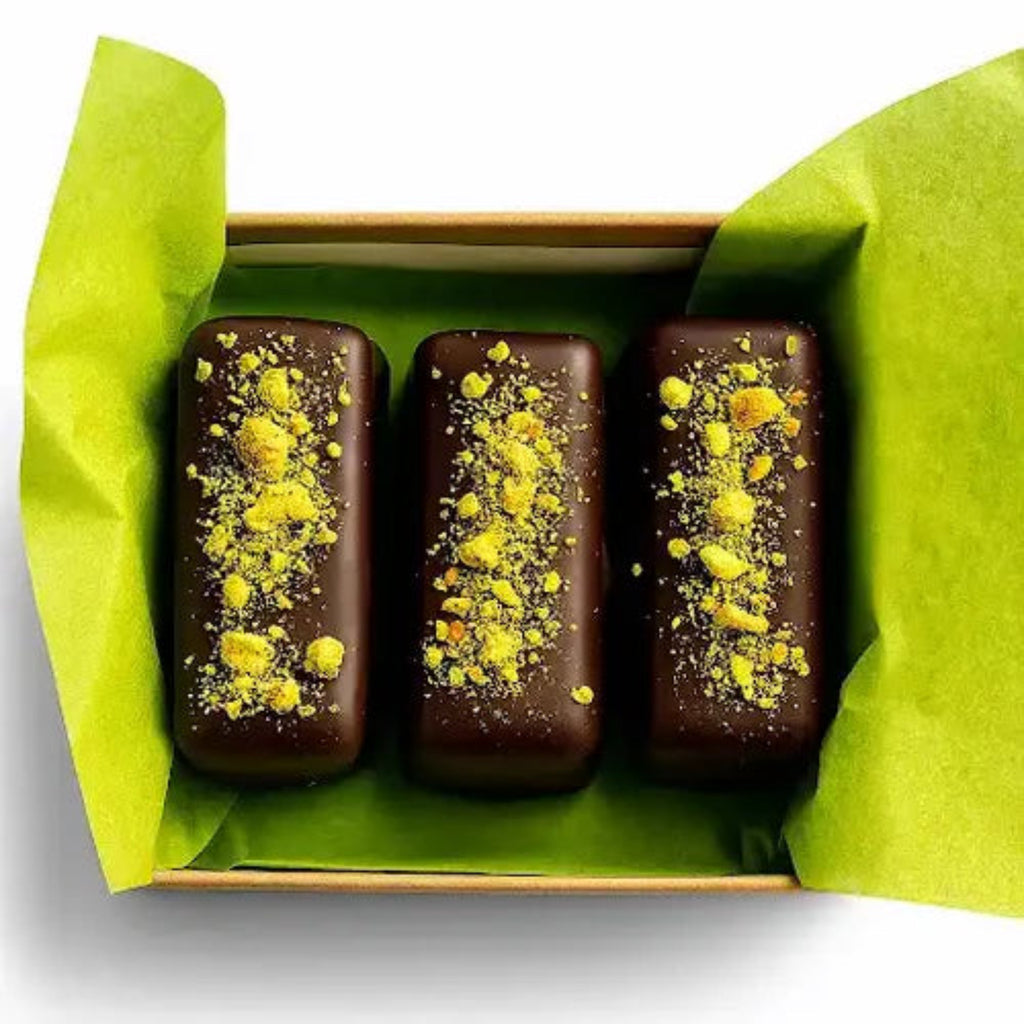 Three Dubai Chocolate Bars from Coracao Chocolate against a white background