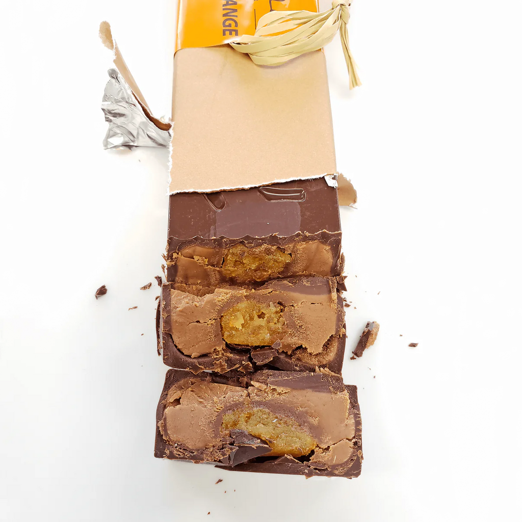 Parially unwrapped 75% Dark Chocolate with Orange & Praline bar